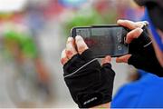 9 May 2014; A spectator records the Team Time Trial event at Titanic Quarter during stage 1 of the Giro d'Italia 2014 on his phone. Belfast, Co. Antrim. Picture credit: Stephen McCarthy / SPORTSFILE