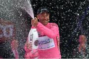 9 May 2014; Svein Tuft, Orica Greenedge, celebrates after being presented with the race leaders pink jersey after stage 1 in the Giro d'Italia 2014. Belfast, Co. Antrim. Picture credit: Stephen McCarthy / SPORTSFILE