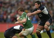 11 March 2006; Jerry Flannery, Ireland, is tackled by Dan Parks, left, and Nathan Hines, Scotland. RBS 6 Nations 2005-2006, Ireland v Scotland, Lansdowne Road, Dublin. Picture credit: Brendan Moran / SPORTSFILE