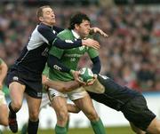 11 March 2006; Shane Horgan, Ireland, is tackled by Dan Parks, left, and Marcus Di Rollo, Scotland. RBS 6 Nations 2005-2006, Ireland v Scotland, Lansdowne Road, Dublin. Picture credit: Brendan Moran / SPORTSFILE
