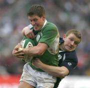 11 March 2006; Ronan O'Gara, Ireland, is tackled by Scott Lawson, Scotland. RBS 6 Nations 2005-2006, Ireland v Scotland, Lansdowne Road, Dublin. Picture credit: Brendan Moran / SPORTSFILE