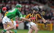 12 March 2006; Mike O'Brien, Limerick, in action against J J Delaney, Kilkenny. Allianz National Hurling League, Division 1B, Round 3, Limerick v Kilkenny, Gaelic Grounds, Limerick. Picture credit: Kieran Clancy / SPORTSFILE