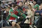 12 March 2006; Peadar Gardiner, Mayo, tries to stop himself from crashing into spectators during the game. Allianz National Football League, Division 1A, Round 4, Mayo v Fermanagh, McHale Park, Castlebar, Co. Mayo. Picture credit: David Maher / SPORTSFILE