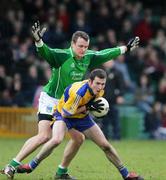 12 March 2006;    Jason Stokes, Limerick, in action against Alan Clohessy, Clare. Allianz National Football League, Division 2A, Round 4, Limerick v Clare, Gaelic Grounds, Limerick. Picture credit: Kieran Clancy / SPORTSFILE
