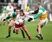 12 March 2006; Brian McGuigan, Tyrone, in action Scott Brady and Alan McNamee, Offaly. Allianz National Football League, Division 1A, Round 4, Offaly v Tyrone, O'Connor Park, Tullamore, Co. Offaly. Picture credit: Oliver McVeigh / SPORTSFILE
