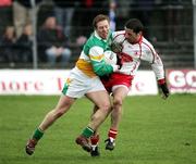 12 March 2006; Neville Coughlin, Offaly, in action against Stephen O'Neill, Tyrone. Allianz National Football League, Division 1A, Round 4, Offaly v Tyrone, O'Connor Park, Tullamore, Co. Offaly. Picture credit: Oliver McVeigh / SPORTSFILE