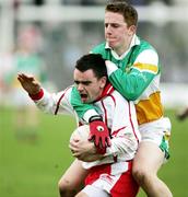 12 March 2006; Ryan McMenamin, Tyrone, in action against Pascal Kellaghan, Offaly. Allianz National Football League, Division 1A, Round 4, Offaly v Tyrone, O'Connor Park, Tullamore, Co. Offaly. Picture credit: Oliver McVeigh / SPORTSFILE