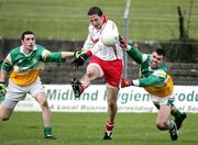 12 March 2006; Stephen O'Neill, Tyrone, clear the ball ahead of Sean Casey and Ger Rafferty, Offaly . Allianz National Football League, Division 1A, Round 4, Offaly v Tyrone, O'Connor Park, Tullamore, Co. Offaly. Picture credit: Oliver McVeigh / SPORTSFILE
