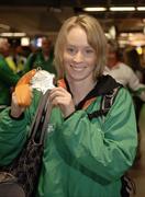 13 March 2006; Derval O'Rourke, who won a gold medal in the 60m Hurdles at the World Indoor Athletics Championships in Moscow, on her arrival home at Dublin Airport, Dublin. Picture credit: Ray McManus / SPORTSFILE
