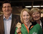 13 March 2006; Derval O'Rourke, who won a gold medal in the 60m Hurdles at the World Indoor Athletics Championships in Moscow, her parents Eva and Terry on her arrival home at Dublin Airport, Dublin. Picture credit: Ray McManus / SPORTSFILE