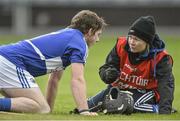 11 May 2014; Dr. Aoife Molloy attends to Laois player Dwane Palmer. GAA All-Ireland Senior Hurling Championship Qualifier Group, Round 3, Laois v Carlow, O'Moore Park, Portlaoise, Co. Laois. Picture credit: David Maher / SPORTSFILE