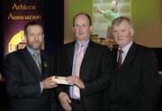 10 March 2006; Ger Harrington is presented with his award by GAA President Sean Kelly and Frank Burke, Chairman of the National Referees’ Committee, right, at the National Referees' Awards Banquet. Croke Park, Dublin. Picture credit: Ray McManus / SPORTSFILE