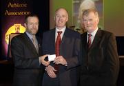 10 March 2006; Jim O'Rourke, from Monaghan, is presented with his award by GAA President Sean Kelly and Frank Burke, Chairman of the National Referees’ Committee, right, at the National Referees' Awards Banquet. Croke Park, Dublin. Picture credit: Ray McManus / SPORTSFILE