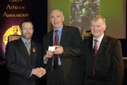 10 March 2006; Gearoid O Conamha, from Galway, is presented with his award by GAA President Sean Kelly and Frank Burke, Chairman of the National Referees’ Committee, right, at the National Referees' Awards Banquet. Croke Park, Dublin. Picture credit: Ray McManus / SPORTSFILE