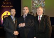 10 March 2006; John Sexton, from Limerick, is presented with his award by GAA President Sean Kelly and Frank Burke, Chairman of the National Referees’ Committee, right, at the National Referees' Awards Banquet. Croke Park, Dublin. Picture credit: Ray McManus / SPORTSFILE