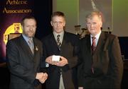 10 March 2006; Denis Richardson, from Limerick, is presented with his award by GAA President Sean Kelly and Frank Burke, Chairman of the National Referees’ Committee, right, at the National Referees' Awards Banquet. Croke Park, Dublin. Picture credit: Ray McManus / SPORTSFILE