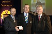 10 March 2006; Tiernach Mahon, from Fermanagh, is presented with his award by GAA President Sean Kelly and Frank Burke, Chairman of the National Referees’ Committee, right, at the National Referees' Awards Banquet. Croke Park, Dublin. Picture credit: Ray McManus / SPORTSFILE