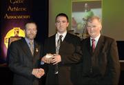 10 March 2006; Jason O'Mahony, from Limerick, is presented with his award by GAA President Sean Kelly and Frank Burke, Chairman of the National Referees’ Committee, right, at the National Referees' Awards Banquet. Croke Park, Dublin. Picture credit: Ray McManus / SPORTSFILE