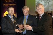 10 March 2006; Paul Kelly, Dublin, is presented with his 'Hall of Fame'  award by GAA President Sean Kelly and Frank Burke, Chairman of the National Referees’ Committee, right, at the National Referees' Awards Banquet. Croke Park, Dublin. Picture credit: Ray McManus / SPORTSFILE
