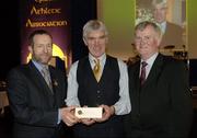 10 March 2006; Pat Moore is presented with his award by GAA President Sean Kelly and Frank Burke, Chairman of the National Referees’ Committee, right, at the National Referees' Awards Banquet. Croke Park, Dublin. Picture credit: Ray McManus / SPORTSFILE