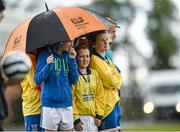 13 May 2014; Pupils from Kilkenny School Project National School take shelter from a shower. Aviva Health FAI Primary School 5’s Leinster Finals, MDL Grounds, Navan, Co. Meath. Photo by Sportsfile