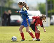 13 May 2014; Cliona Donnelly, Kilkenny School Project National School, in action against Chloe Doyle, St. Ultan's Primary School, Cherry Orchard. Aviva Health FAI Primary School 5’s Leinster Finals, MDL Grounds, Navan, Co. Meath. Photo by Sportsfile