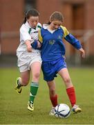 13 May 2014; Cliona Donnelly, Kilkenny School Project National School, in action against Clodagh Dillon, Milltown National School, Co. Westmeath. Aviva Health FAI Primary School 5’s Leinster Finals, MDL Grounds, Navan, Co. Meath. Photo by Sportsfile