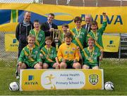 13 May 2014; Pupils from St Josephs NS, Carrickmacross, Co. Monaghan, along with Damien Flaherty, Aviva, middle, and Alex Harkin, FAI Schools, celebrate with the cup after winning the Boy's section 1. Aviva Health FAI Primary School 5’s Ulster Finals, Ballyare, Donegal League HQ, Letterkenny, Co. Donegal. Picture credit: Oliver McVeigh / SPORTSFILE