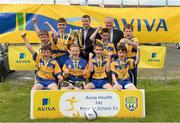 13 May 2014; Butlersbrige NS, Co. Cavan, with Damien Flaherty, Aviva, centre, and Alex Harkin, FAI Schools, celebrate with the cup after winning the Boy's section 2. Aviva Health FAI Primary School 5’s Ulster Finals, Ballyare, Donegal League HQ, Letterkenny, Co. Donegal. Picture credit: Oliver McVeigh / SPORTSFILE