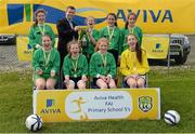 13 May 2014; Woodland NS, Letterkenny, Co. Donegal, celebrate with the cup after winning the Girl's section 1, with Damien Flaherty, Aviva. Aviva Health FAI Primary School 5’s Ulster Finals, Ballyare, Donegal League HQ, Letterkenny, Co. Donegal. Picture credit: Oliver McVeigh / SPORTSFILE