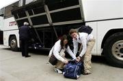 15 March 2006; Ruth Stephens, left, and Aoibheann Daly, both from Galway, get ready to board a bus, prior to their departure to Singapore for the O'Neills / TG4 Ladies All-Stars tour 2006. Croke Park, Dublin. Picture credit: David Maher / SPORTSFILE