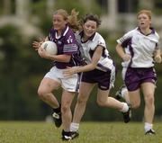 18 March 2006; Mary Nevin, Dublin, 2004 O'Neills / TG4 Ladies GAA All-Stars, is tackled by Lyndsay Davey, Dublin, 2005 O'Neills / TG4 Ladies GAA All-Stars. Singapore Polo Club, Singapore. Picture credit: Ray McManus / SPORTSFILE
