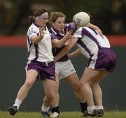 18 March 2006; Valerie Mulcahy, Cork, 2004 O'Neills / TG4 Ladies GAA All-Stars, is tackled by Briege Corkery, Cork, and Sharon Treacy, Longford, 2005 O'Neills / TG4 Ladies GAA All-Stars. Singapore Polo Club, Singapore. Picture credit: Ray McManus / SPORTSFILE