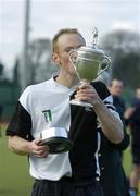 19 March 2006; Cork Harlequins captain Jason Black kisses the cup after the game. Irish Men's Senior Cup Final, Cork Harlequins v Lisnagarvey, Belfield, UCD, Dublin. Picture credit: Brendan Moran / SPORTSFILE