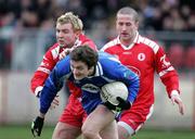 19 March 2006; Dermot Mc Ardle, Monaghan, is tackled by Owen Mulligan, Tyrone. Allianz National Football League, Division 1A, Round 5, Tyrone v Monaghan, Healy Park, Omagh, Co. Tyrone. Picture credit: Oliver McVeigh / SPORTSFILE
