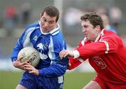 19 March 2006; Damien Freeman, Monaghan, is tackled by Dermot Carlin, Tyrone. Allianz National Football League, Division 1A, Round 5, Tyrone v Monaghan, Healy Park, Omagh, Co. Tyrone. Picture credit: Oliver McVeigh / SPORTSFILE