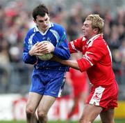19 March 2006; Donal Morgan, Monaghan, is tackled by Owen Mulligan, Tyrone. Allianz National Football League, Division 1A, Round 5, Tyrone v Monaghan, Healy Park, Omagh, Co. Tyrone. Picture credit: Oliver McVeigh / SPORTSFILE