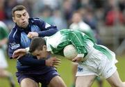 19 March 2006; Aidy Little, Fermanagh, is tackled by David Henry, Dublin. Allianz National Football League, Division 1A, Round 5, Fermanagh v Dublin, Brewster Park, Enniskillen, Co. Fermanagh. Picture credit: Ray Lohan / SPORTSFILE