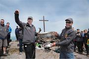 16 May 2014; Legendary GAA Commentator Mícheál Ó Muircheartaigh lifts the Sam Maguire Cup on the Summit of Carrauntoohil, MacGillycuddy's Reeks, Co. Kerry, with programme director and former Galway star Alan Kerins during the 'Sam to Summit' in aid of the Alan Kerins Project which saw Sam Maguire and representatives and players with All-Ireland football medals from each of the 32 counties reach the top of Ireland’s highest mountain. Carrauntoohil, Co. Kerry. Picture credit: Valerie O'Sullivan / SPORTSFILE