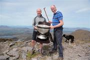 16 May 2014; Former Tyrone player Peter Canavan, left, and  Davie Leane, a 7th generation sheep farmer,  with the Sam Maguire Cup on the summit of Carrauntoohil, MacGillycuddy's Reeks, Co. Kerry, during the 'Sam to Summit' in aid of the Alan Kerins Project which saw Sam Maguire and representatives and players with All-Ireland football medals from each of the 32 counties reach the top of Ireland’s highest mountain. Carrauntoohil, Co. Kerry. Picture credit: Valerie O'Sullivan / SPORTSFILE