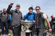 16 May 2014; Legendary GAA Commentator Mícheál Ó Muircheartaigh lifts the Sam Maguire Cup on the Summit of Carrauntoohil, MacGillycuddy's Reeks, Co Kerry, Kerry's Seamus Moynihan andh Guide Piaras Kelly, Kerry Climbing, right, the unique event 'Sam to Summit' in aid of the Alan Kerins Projects which saw Sam Maguire and representatives and players with All Ireland football medals from each of the 32 counties reach the top of Ireland’s highest mountain. Picture credit: Valerie O'Sullivan / SPORTSFILE