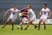 17 May 2014; Damian Dolan, Westmeath, in action against Andy McDonnell, left, Paddy Keenan and Derek Crilly, right, Louth. Leinster GAA Football Senior Championship, Round 1, Westmeath v Louth, Cusack Park, Mullingar, Co. Westmeath. Photo by Sportsfile