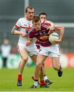 17 May 2014; John Heslin, Westmeath, in action against Paddy Keenan, Louth. Leinster GAA Football Senior Championship, Round 1, Westmeath v Louth, Cusack Park, Mullingar, Co. Westmeath. Photo by Sportsfile