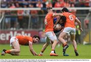29 May 2016; Conor Moynagh of Cavan is tackled by Mark Shields, left, and Aidan Forker of Armagh in the Ulster GAA Football Senior Championship quarter-final between Cavan and Armagh at Kingspan Breffni Park, Cavan. Photo by Ramsey Cardy/Sportsfile