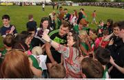 29 May 2016; Aidan O’Shea of Mayo poses for photos with supporters following the Connacht GAA Football Senior Championship quarter-final between London and Mayo in Páirc Smárgaid, Ruislip, London, England. Photo by Seb Daly/Sportsfile