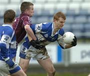 25 March 2006; Colm Kelly, Laois, is tackled by Conor Jordan, Westmeath. Leinster U21 Football Championship Semi-Final, Laois v Westmeath, O'Moore Park, Portlaoise, Co. Laois. Picture credit: Matt Browne / SPORTSFILE