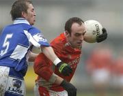26 March 2006; Malachy Mackin, Armagh, in action against Joe Higgins, Laois. Allianz National Football League, Division 1B, Round 6, Armagh v Laois, St. Oliver Plunkett Park, Crossmaglen, Co. Armagh.Picture credit: Brian Lawless / SPORTSFILE