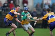 26 March 2006;   Alan Egan, Offaly, in action against Diarmuid McMahon and Paddy Vaughan, Clare. Allianz National Hurling League, Division 1A, Round 4, Clare v Offaly, Cusack Park, Ennis, Co. Clare. Picture credit: Kieran Clancy / SPORTSFILE