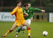 27 March 2006; Christy Fagan, Republic of Ireland, in action against Marian Liviu Militaru, Romania. U17 UEFA Championship Qualifier, Republic of Ireland v Romania, Dalymount Park, Dublin. Picture credit: Brendan Moran / SPORTSFILE