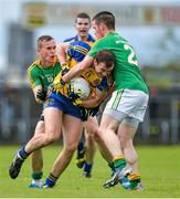 18 May 2014; Senan Kilbride, Roscommon, in action against Michael McWeeney, left, and Barry Prior, 2, Leitrim. Connacht GAA Football Senior Championship Quarter-Final, Roscommon v Leitrim, Dr. Hyde Park, Roscommon. Picture credit: Piaras Ó Mídheach / SPORTSFILE